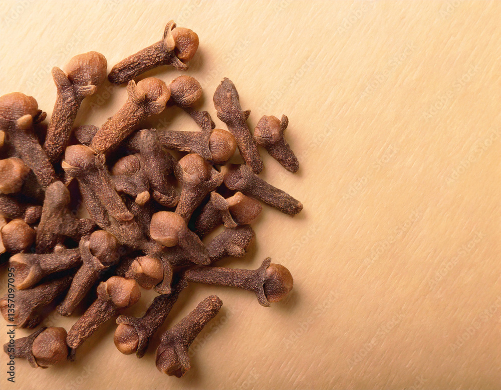 cloves group isolated on light brown background cloves group isolated on light brown background