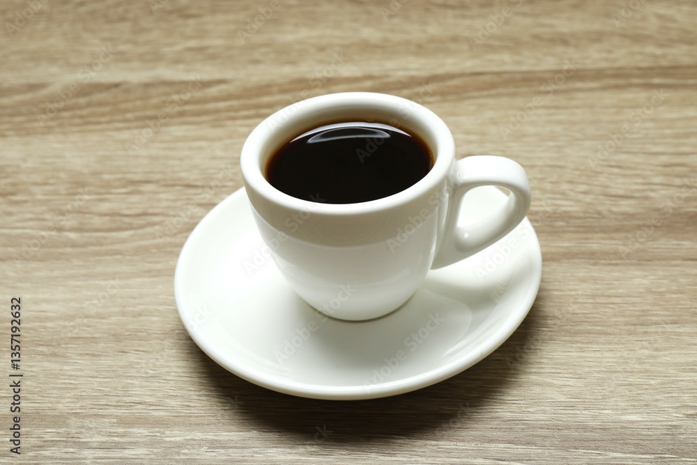 Cuo of coffee with coffee beans on wooden background Cuo of coffee with coffee beans on wooden background