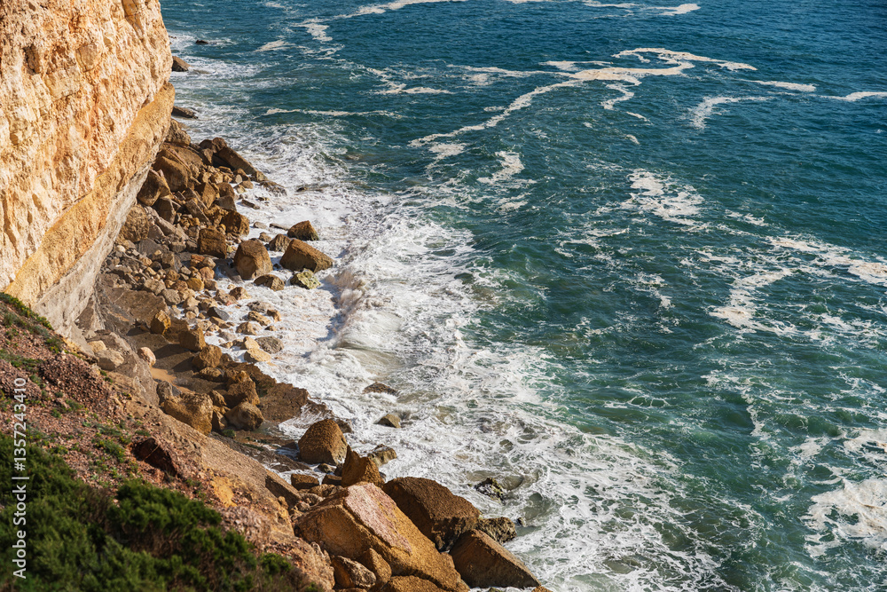 View of the sea cliffs in the ocean in Nazare, Portugal
