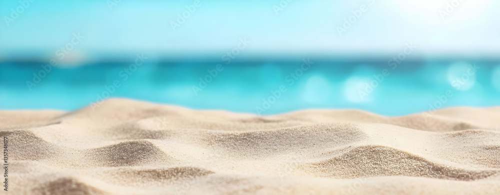 Obraz premium A serene beach scene featuring soft, golden sand and tranquil turquoise waters, perfect for relaxation and escape.