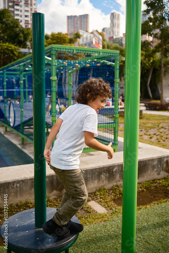 Child balancing and jumping in a city playground