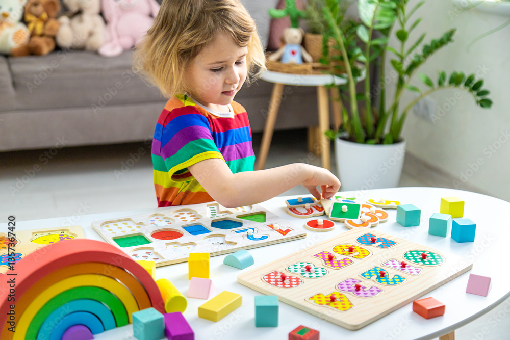 Fototapeta premium Child learns numbers and letters. Selective focus.