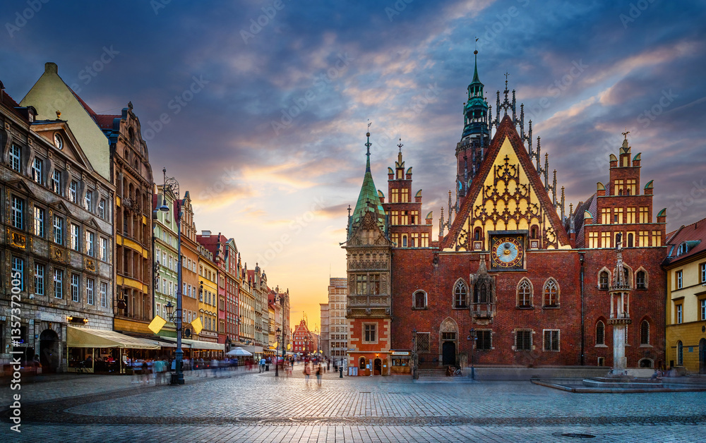 Fototapeta premium Wroclaw central market square with old houses and sunset. Panoramic evening view, long exposure, timelapse. Historical capital of Silesia, Wroclaw (Breslau) , Poland, Europe.