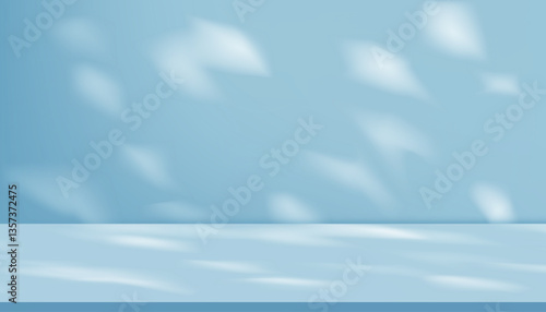 Shadow leave and blur gradient light on blue studio background wall room and podium stage for product,Summer or Spring banner blue pastel with abstract sunlight on floor texture