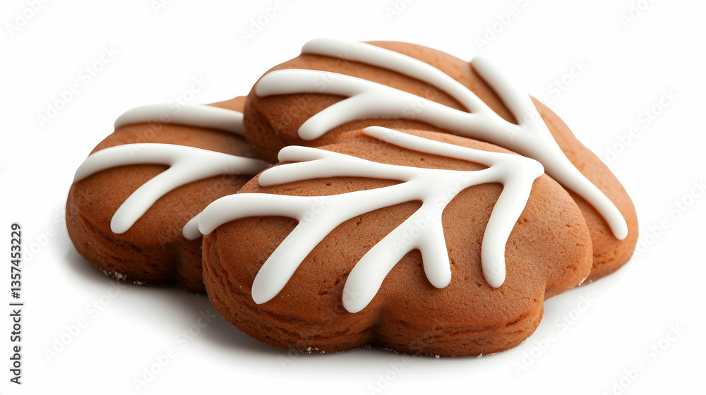Three Brown Gingerbread Cookies with White Icing in Leaf Shapes on White Background Three Brown Gingerbread Cookies with White Icing in Leaf Shapes on White Background