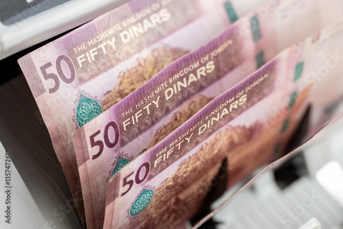 Obraz na płótnie Jordan money, Counting machine Jordanian 50 dinar banknotes. Financial concept. Converting revenue, currency exchange, Business and Economy, Symbol JOD. close up w salonie