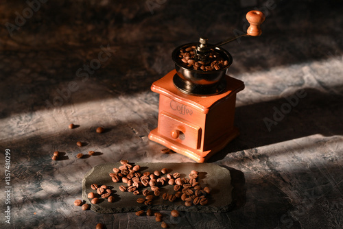 coffee beans scattered on the table. manual coffee grinder