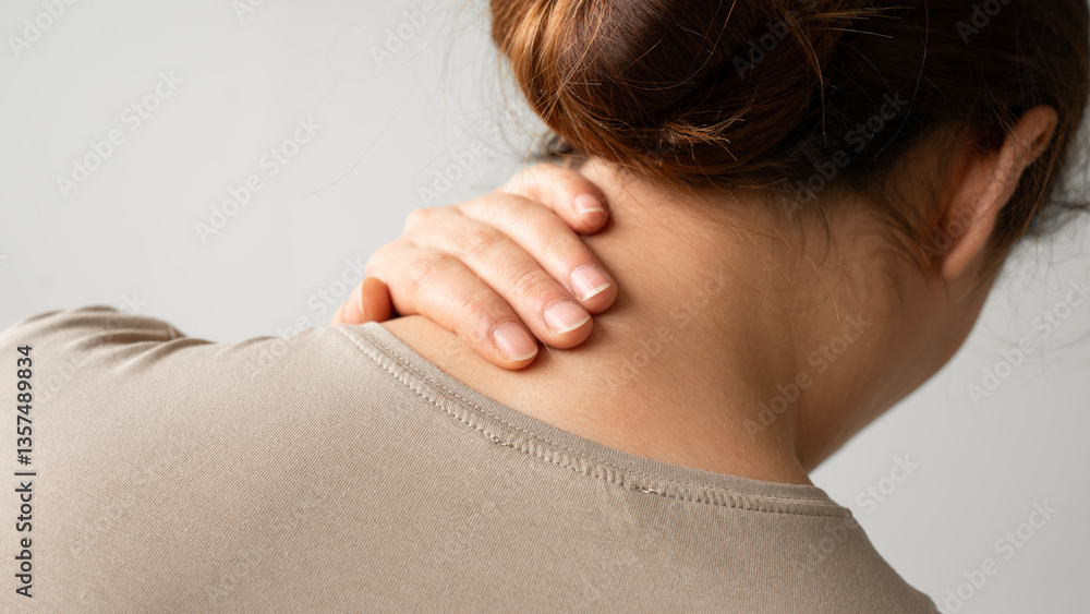 Woman suffering from neck pain Woman suffering from neck pain