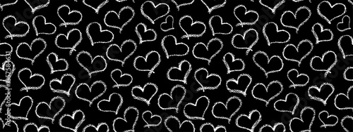 Seamless hearts pattern. White crayon stroke love symbols in doodle style. Ornament of hand drawn kid hearts elements. Graffiti monochrome signs drawn by wax pencil. Vector illustration.