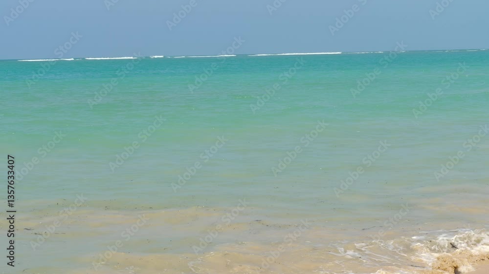 Crystal-clear azure seawater sparkles under the sunlight, gently lapping against the shore in a breathtaking coastal scene of Thailand. Tropical paradise. Crystal-clear azure seawater sparkles under the sunlight, gently lapping against the shore in a breathtaking coastal scene of Thailand. Tropical paradise.