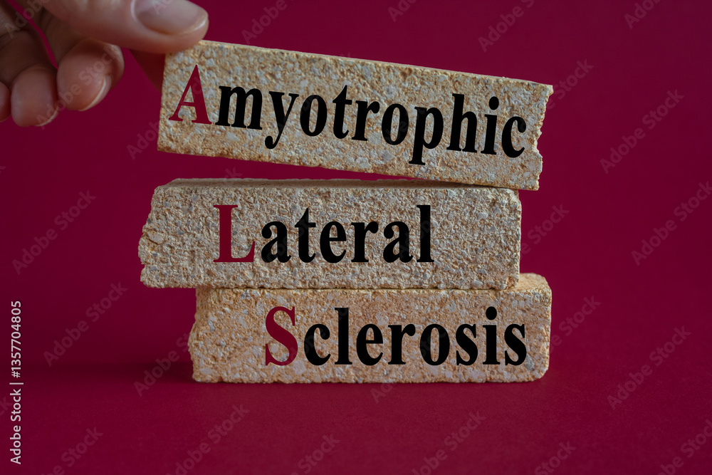Amyotrophic Lateral Sclerosis symbol on brick blocks. Brick blocks with words Amyotrophic Lateral Sclerosis. Beautiful red background. Doctor hand. Medical concept.