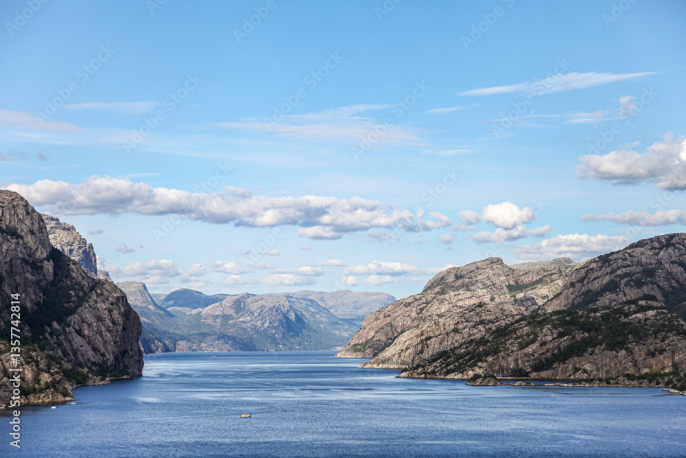 Naklejka premium A beautiful lake fjord with mountains in the background in Norway