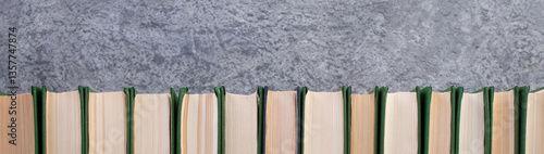 books on the gray concrete background. Back to school. Education. Copy space for text. panorama, banner.