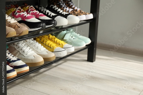 Obraz na płótnie Shoe storage bench with different footwear indoors, closeup. Space for text w salonie