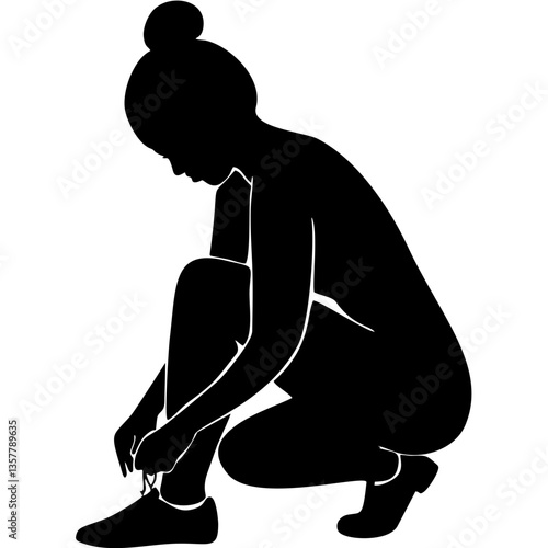 Silhouette of woman tying shoelaces in athletic wear
