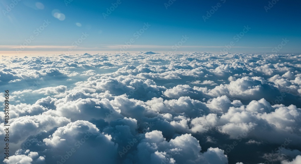 Naklejka premium Stunning Aerial View of a Sea of Fluffy Cumulus Clouds under a Bright Blue Sky