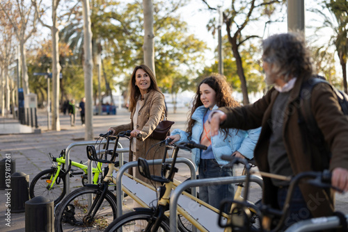 Photography Family picking up rental bikes in barcelona