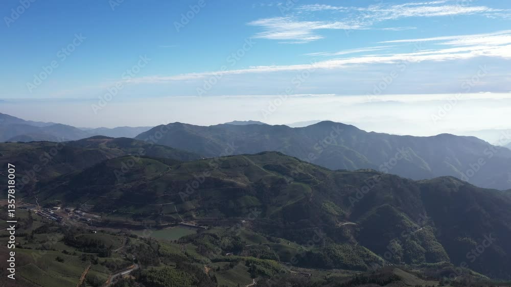 Aerial view of wind turbines on dongbai mountain and many mountains far away in the morning, Dongyang Zhejiang China. High quality 4k footage Aerial view of wind turbines on dongbai mountain and many mountains far away in the morning, Dongyang Zhejiang China. High quality 4k footage