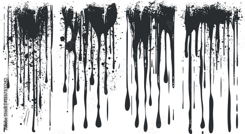 Black ink dripping and splattering on a white background, creating abstract art.