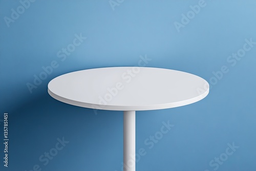 Empty white round table against a light blue backdrop