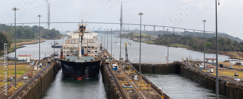 A new container ship prepares to enter the old locks of the Panama Canal
