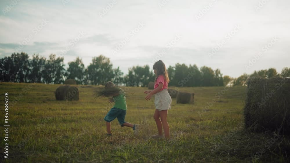 Excited siblings joyfully toss hay in open countryside field at dusk, laughter fills air as they play freely, surrounded by nature, golden sunlight casts a warm glow Excited siblings joyfully toss hay in open countryside field at dusk, laughter fills air as they play freely, surrounded by nature, golden sunlight casts a warm glow