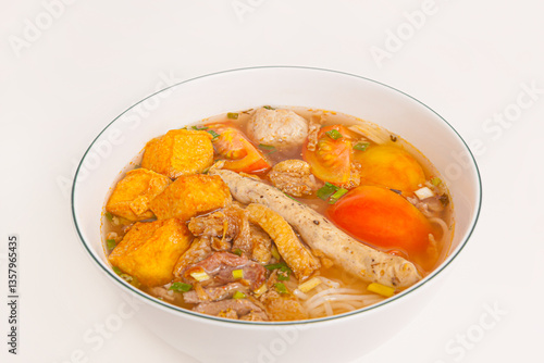 Bun Rieu Cua, Crab paste vermicelli soup with minced shrimp, tofu, tomato, shrimp paste, Vietnamese food isolated on white background, close up