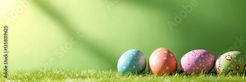 Four brightly colored Easter eggs rest on fresh green grass. Generated AI