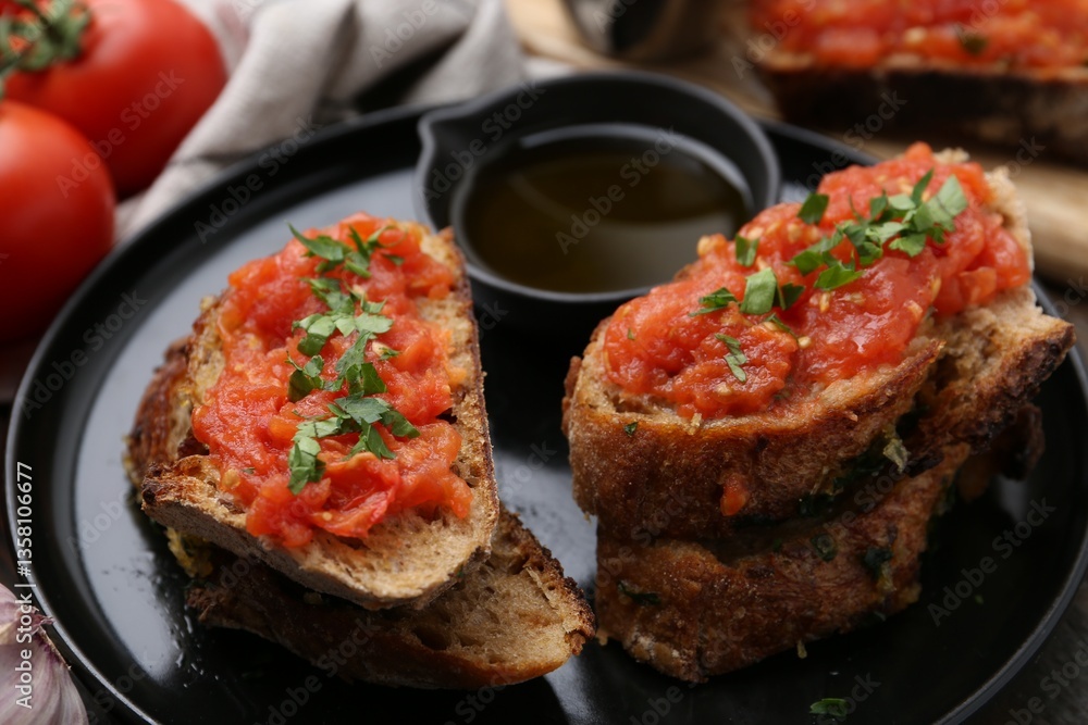 Tasty bread with tomatoes, parsley and oil on table, closeup Tasty bread with tomatoes, parsley and oil on table, closeup