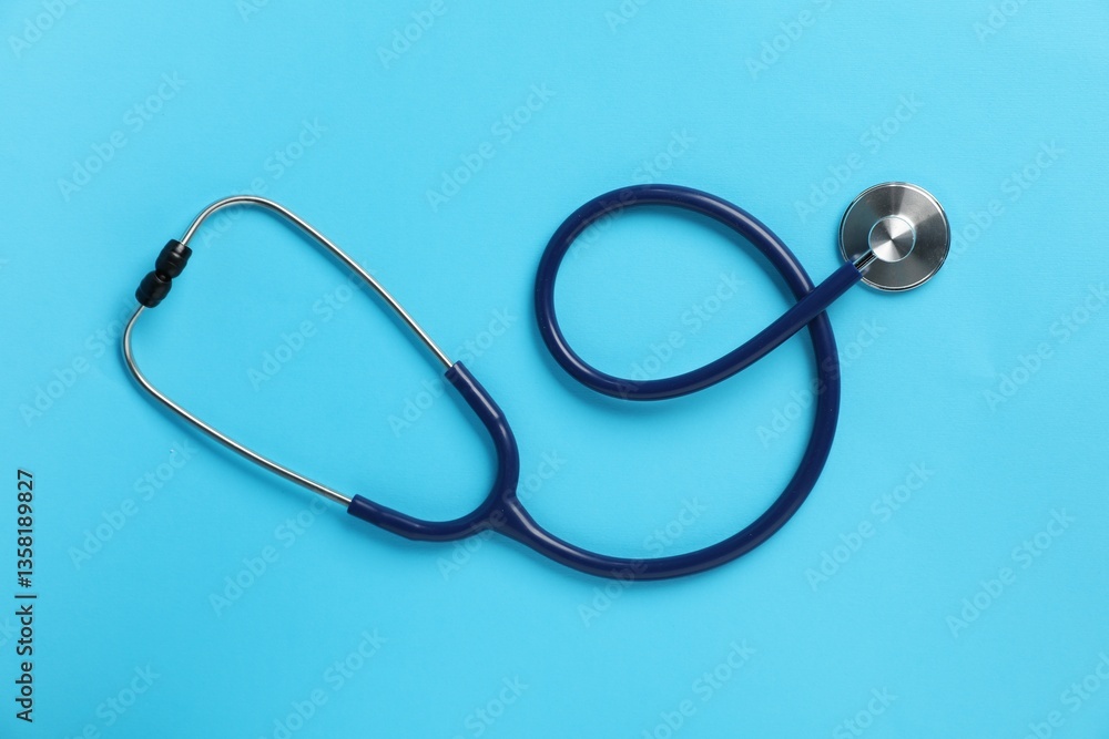 Stethoscope on light blue background, top view Stethoscope on light blue background, top view