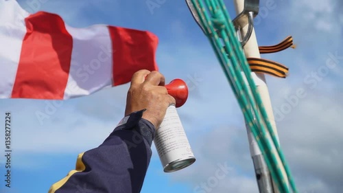 Hand air horn with sky background