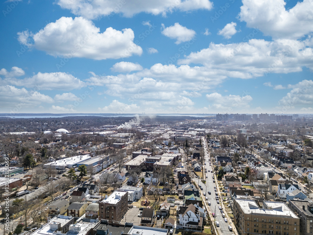 Fototapeta premium Aerial view over Brooklyn featuring Belt Parkway, Shirley Chisholm State Park, Spring Creek Beach, Pennsylvania Ave, Flatlands Ave, and Howard Beach.