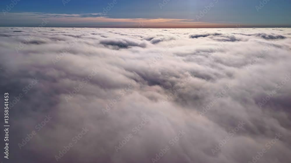 Sunshine lights top of thick clouds layer, aerial drone view Sunshine lights top of thick clouds layer, aerial drone view