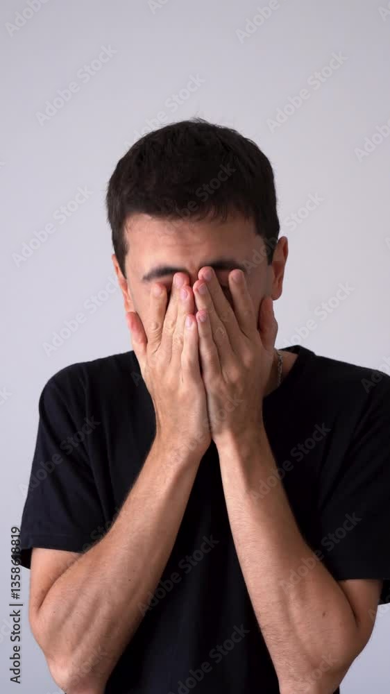 Vertical View Of A Man Feeling Deep Sadness Of Emotions. Close-up Shot Vertical View Of A Man Feeling Deep Sadness Of Emotions. Close-up Shot