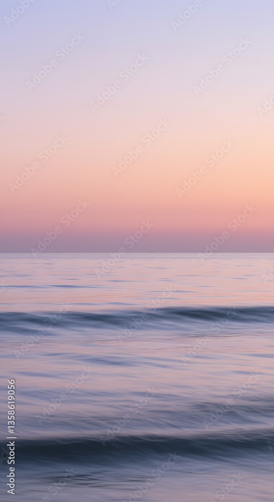 Fototapeta premium Blurry Ocean Horizon with Soft Waves and a Pastel Sunrise Sky
