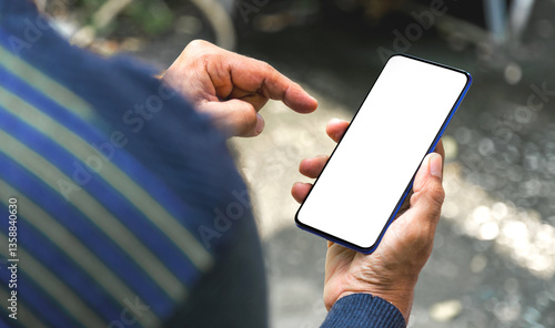 Image of man's hand holding a smartphone with white space on the mobile screen for inserting text or advertising banner.