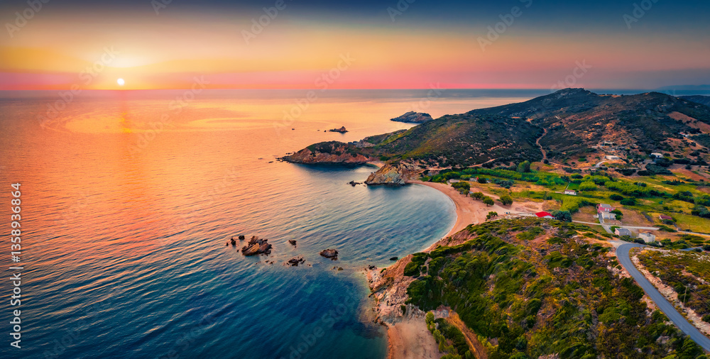 Fantastic summer view from flying drone of Cheromylos beach with endless horizon. Wonderful sunrise on Euboea island, Greece. Picturesque Aegean seascape. Beauty of nature concept background.