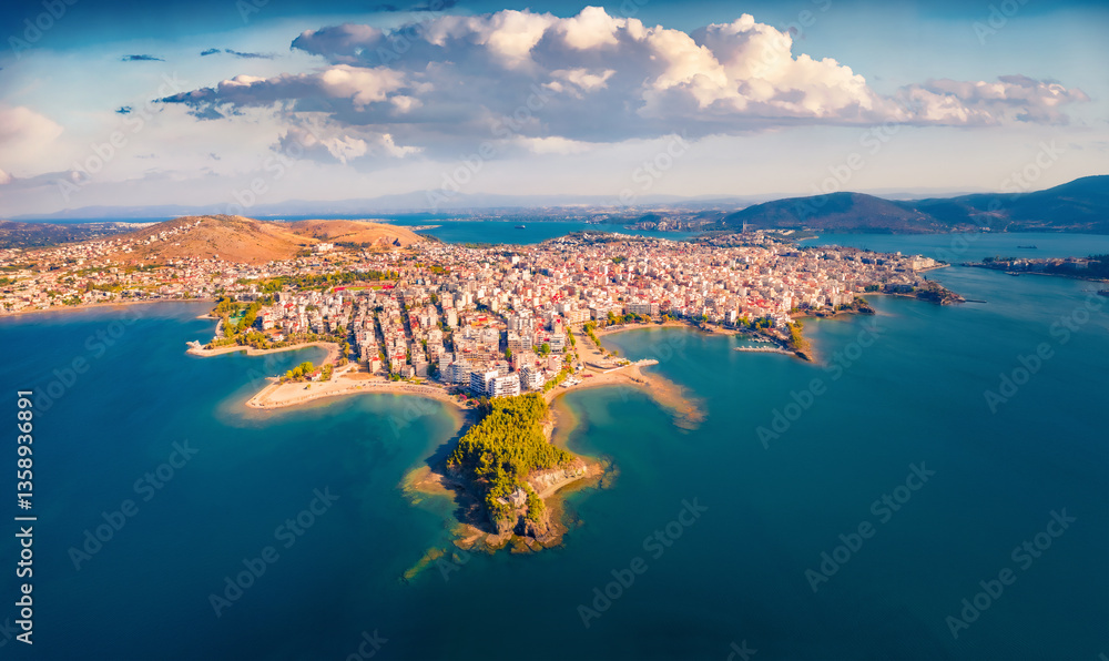 Fototapeta premium Breathtaking summer view from flying drone of Chalcis town. Amazing morning seascape of Aegean sea, North Euboean Gulf. Fantastic outdoor scene of Euboea island, Greece. Traveling concept background.