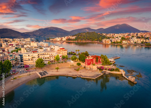 Obraz na płótnie Astonishing summer cityscape of Chalcis town. Impressive sunrise on Aegean sea, North Euboean Gulf. Superb morning scene of Euboea island, Greece, Europe. Traveling concept background. w salonie