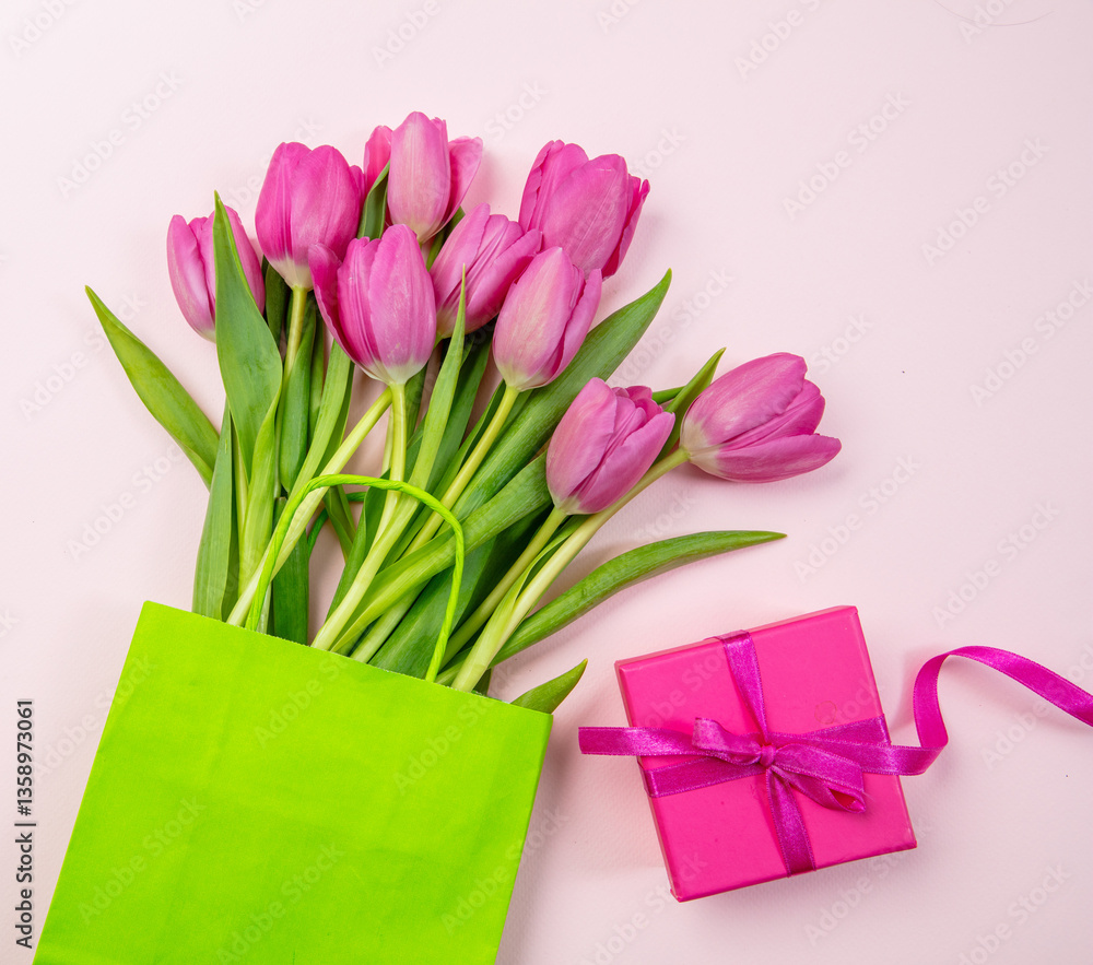 Fototapeta premium Mother day gift. Tulip flower bunch on pastel pink. Fresh flowers bouquet. Spring