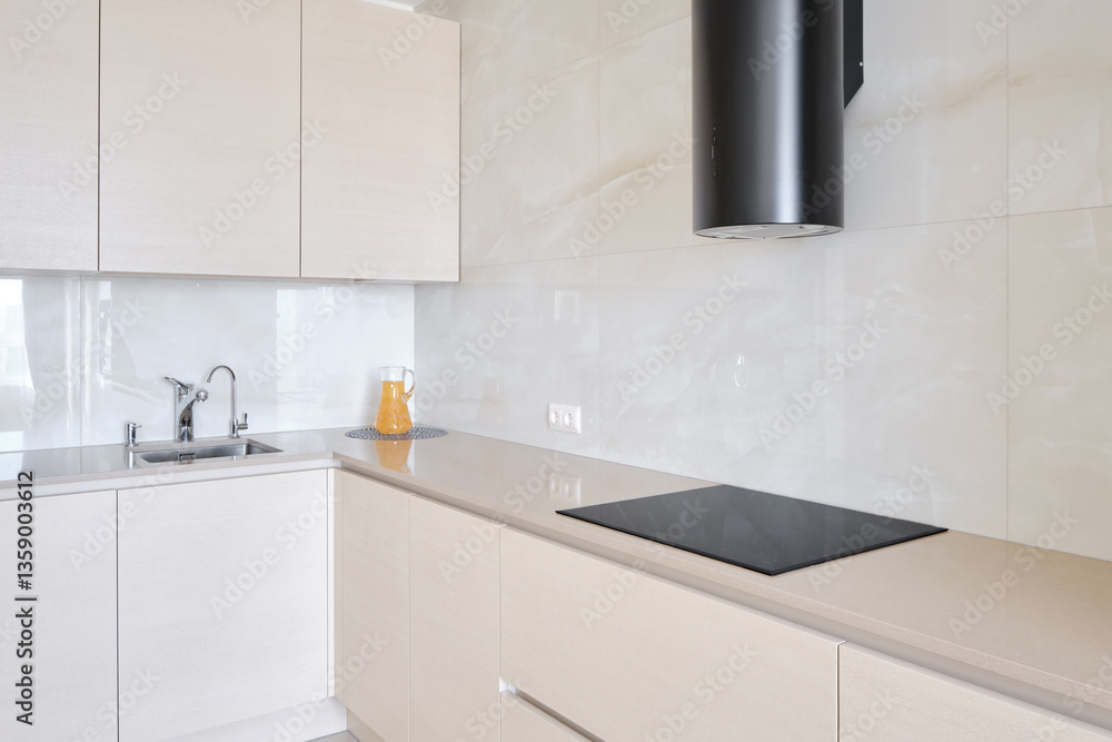Modern kitchen with sleek design and minimalistic features in bright natural light Modern kitchen with sleek design and minimalistic features in bright natural light