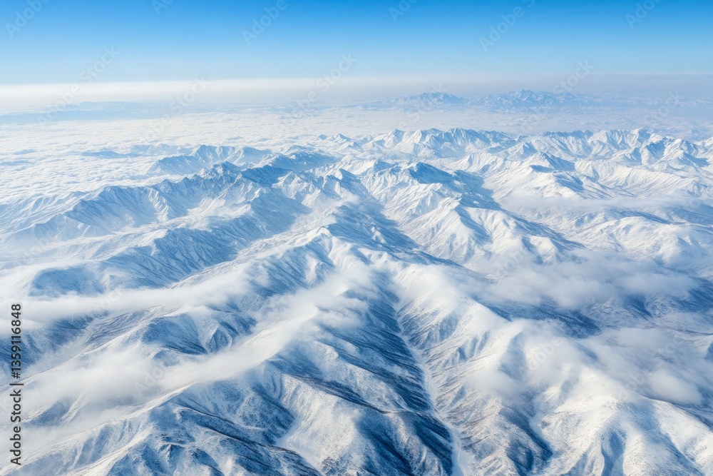 Fototapeta premium Awe-Inspiring Aerial View of Snowy Mountain Ranges
