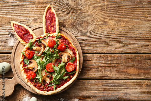 Board with tasty pizza on w...