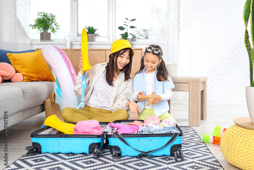Young Asian mother and her ...
