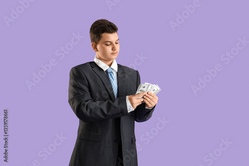 Teenage businessman countin...