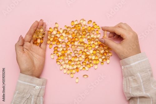 Female hands with fish oil ...
