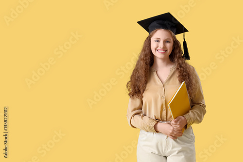 Happy female student in gra...