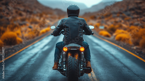 Biker on Motorcycle Traveling Down a Scenic Highway.