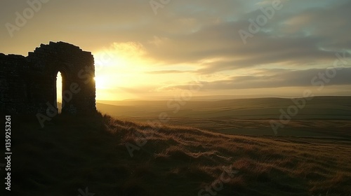 Ancient stone ruins silhouetted during a beautiful sunrise over a hill