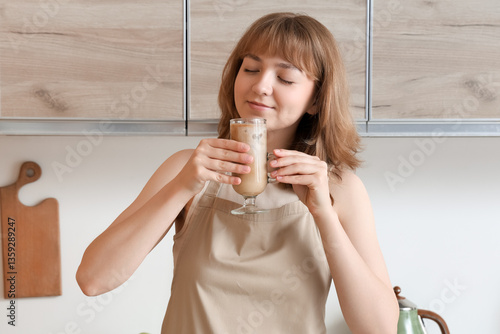 Young woman with glass of t...